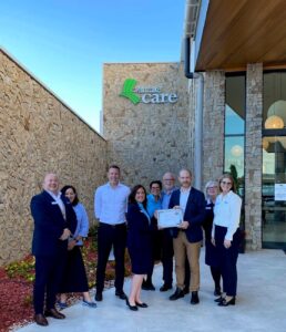 ACCPA CEO Tom Symondson presents Excellence Awards finalist certificate to Palm Lake Care team in Queensland