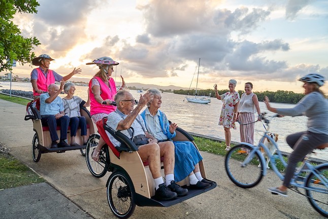 Elderly people riding on trishaw